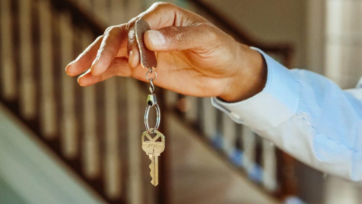 Person Holding a Silver Keychain with a Key For a new home-you need a checklist.